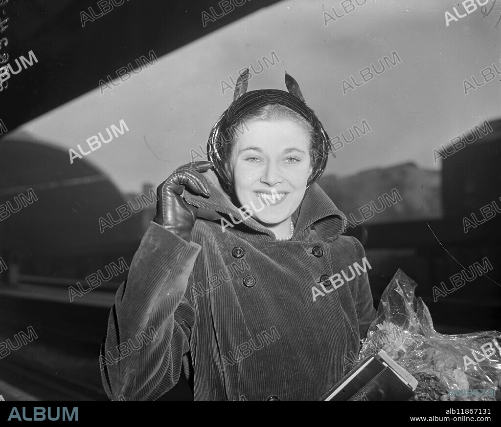 BARCELONA BOUND. British film actress HY HAZEL wears a high-collared corduroy coat as she boarded the Golden Arrow at Victoria Station, London bound for Barcelona. Miss Hazel, known as. ' The Girl with the longest legs in show business ' will appear in cabaret in Spain. On her return to Britain -- in a months time -- to begin rehearsing for pantomime. 16 October 1950.