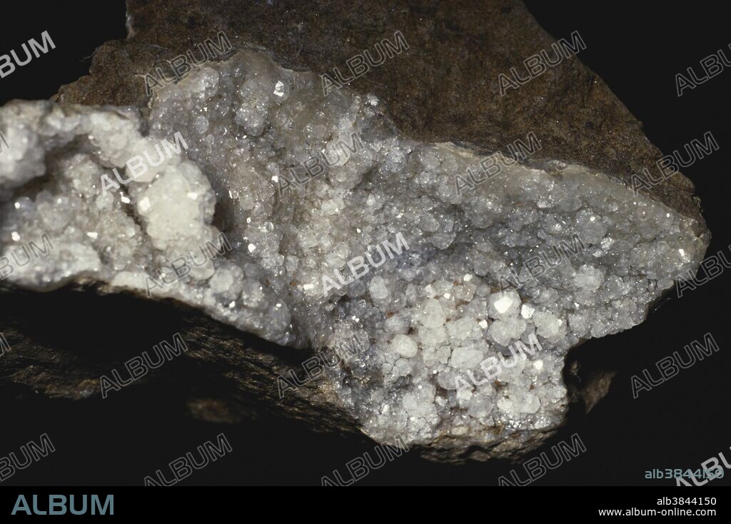 Analcite, also called analcime, is a zeolite mineral found in basalt and other igneous rocks.