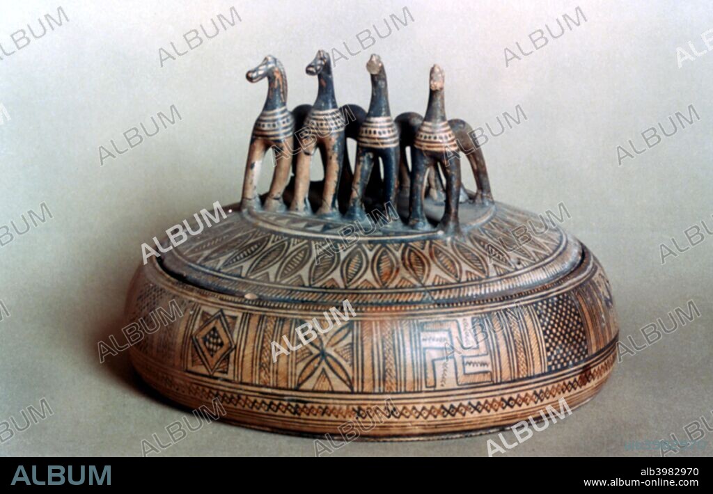 Greek pyxide, 9th-8th century BC. A cylindrical, flat-bottomed box. Located in the Louvre, Paris.