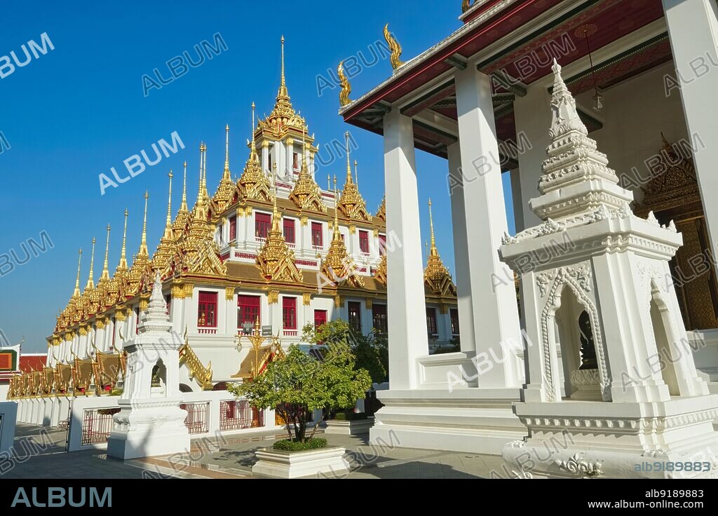 Thailand: The Loha Prasad building (Brazen Palace or Iron Monastery), modelled on an ancient Buddhist monastery in Sri Lanka, in the grounds of Wat Ratchanatda, Bangkok. Wat Ratchanatda (Wat Ratchanaddaram) was built on the orders of King Nangklao (Rama III) for Mom Chao Ying Sommanus Wattanavadi in 1846. The temple is best known for the Loha Prasada (Loha Prasat), a multi-tiered structure 36 m high and having 37 metal spires.