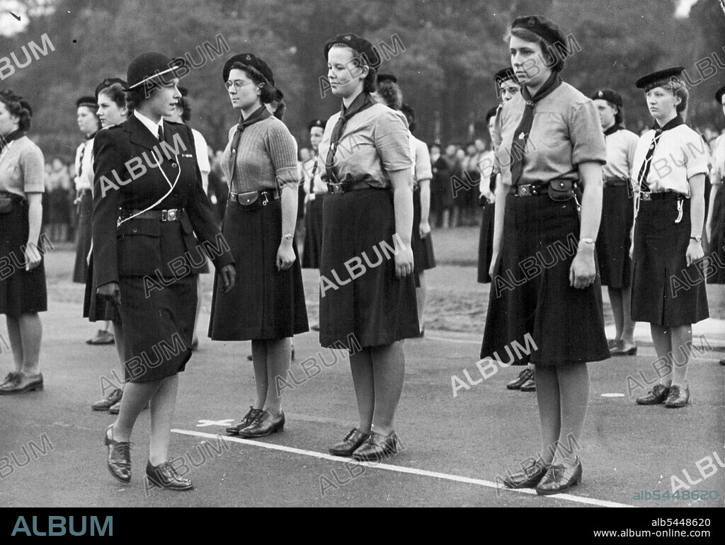 Girl Guides Rally in Hyde Park - Princess Elizabeth inspecting the guard of honour of Sea Rangers in Hyde Park, London, this afternoon (Sunday). More than 7,000 Girl Guides from London and the provinces marched to Hyde Park London, this afternoon (Sunday) to take part in a drum-head service and march-past. Princess Elizabeth and Princess Margaret were there to take the salute at the march past. The Drumhead service was conducted by the Bishop of Willesden, the Rt. Rev. E.M.G. Jones. May 19, 1946.