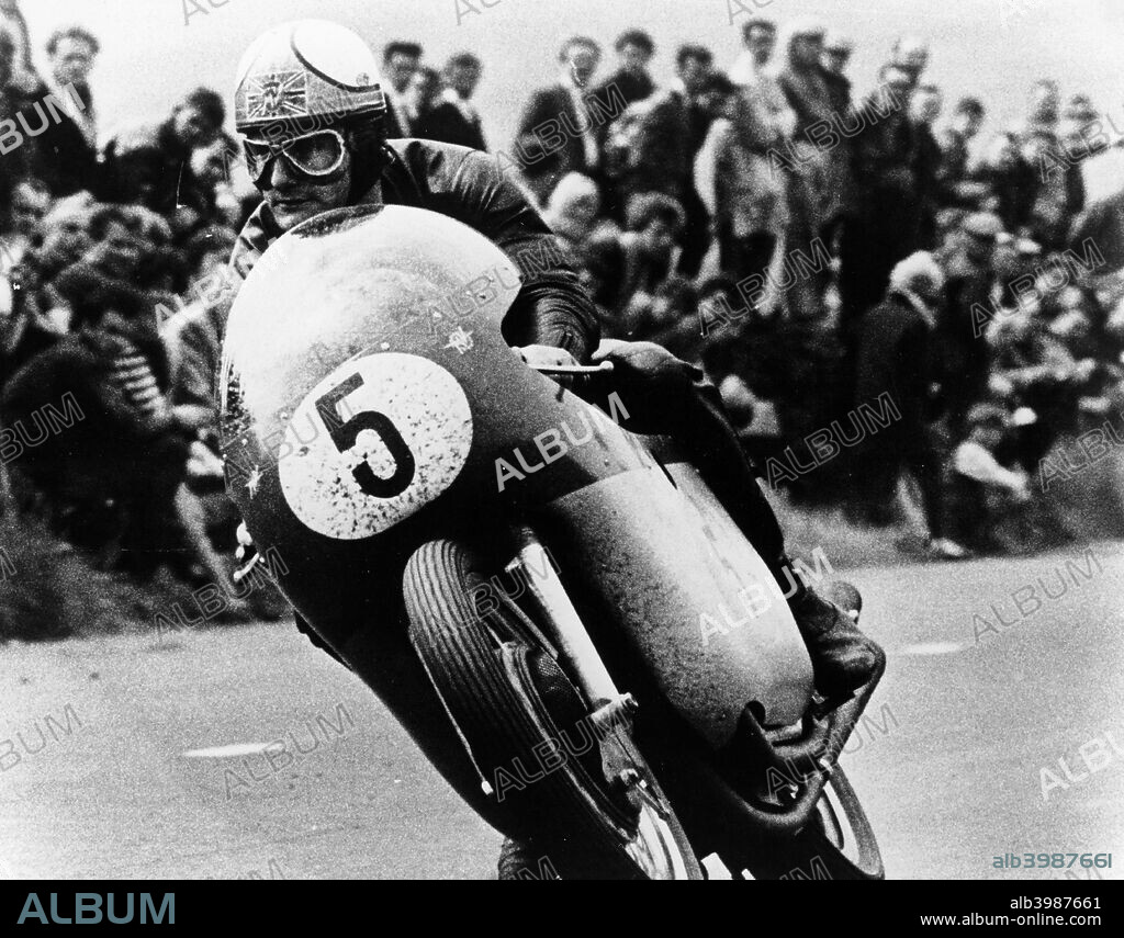 Mike Hailwood, on an MV Agusta, winner of the Isle of Man Senior TT, 1964.  Known as Mike the Bike, he won his first World Championship at the age of twenty one. He won nine World Championships, 76 Grand Prix wins and fourteen Isle Of Man TT races. In 1967 he turned to motor racing.