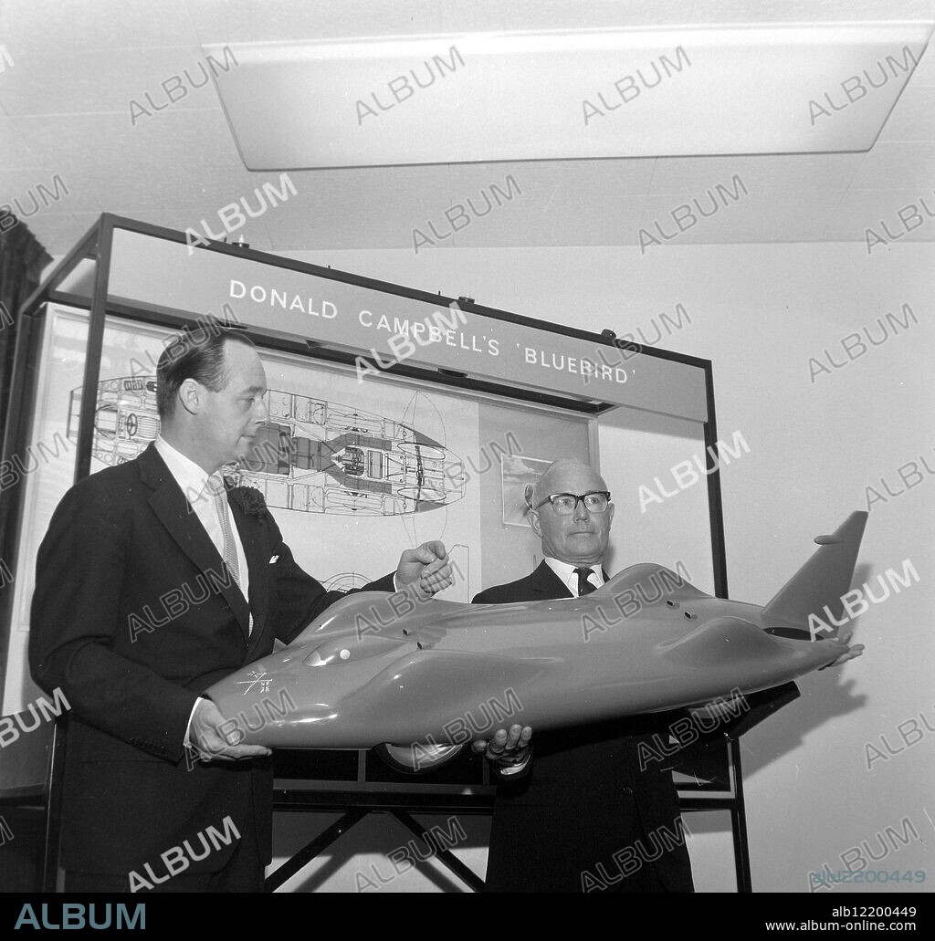 LEO VILLA AND DONALD CAMPBELL WITH A MODEL OF PRTEUS BLUEBIRD ;. 24 OCTOBER 1962.