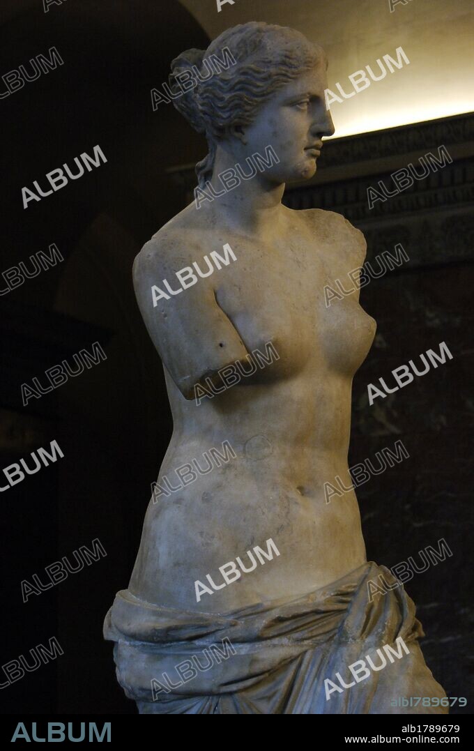 Greek Art. Statue of Aphrodite of Milos, known as the Venus de Milo (130-100 B.C.) by Alexandros of Antioch. Marble. It is believed to depict the Greek goddess of love and beauty, Aphrodite. Three-quarter view. Detail. Louvre Museum. Paris. France.