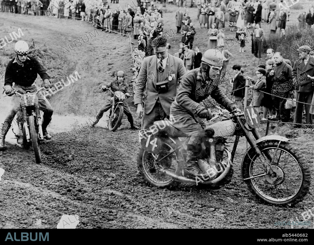 Hobby Riders Test Motorcycles -- Muddy going as Britain's amateur motorcyclist compete in inter-Club scramble. Simulating worst possible motorcycling conditions, with addition of competitive urge of racing, enthusiasts of British motor cycle clubs prove sternest critics of manufacturing quality for machines finding markers all over the world. March 11, 1952. (Photo by Central Office of Information, London).