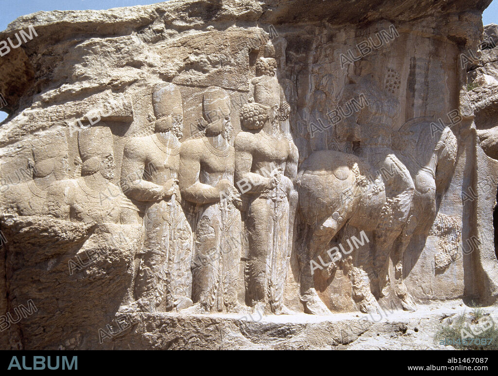 Sasanians. Relief of Shapur's Parade depicting the King Shapur I riding a horse, folllowed by his sons and other characters. 3rd century. It celebrates the king's military victory in 244 over the Roman emperor Valerian and Philip the Arab. Naqsh-e Rajab. Fars Province, Iran (Old Persia).