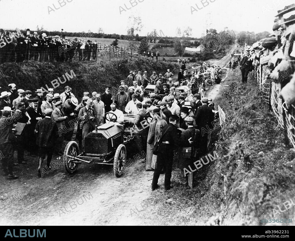 Selwyn Francis Edge in a Napier, 1903 Gordon Bennett race. The Gordon Bennett Races were organised by James Gordon Bennett, proprietor of the New York Herald newspaper to help promote the motor industry. The first race was held between Paris and Lyon in 1900, but in 1903 the race was staged on a circuit for the first time, at Athy in Ireland. The Gordon Bennett Races are regarded as the birth of the idea of Grand Prix motor racing. Selwyn Francis Edge was disqualified from the 1903 race for receiving a push start, having won the previous year's event.