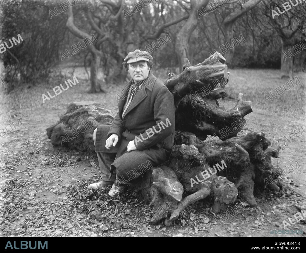 Famous sculptor who is executing Hudson memorial for Hyde Park bird sanctuary . Mr Jacob Epstein , who is executing the work of the Memorial to the field naturalist , Mr W H Hudson , has a cottage studio on the edge of Epping Forest , and is here seen enjoying a quiet hour in that ancient woodland . 5 March 1925.