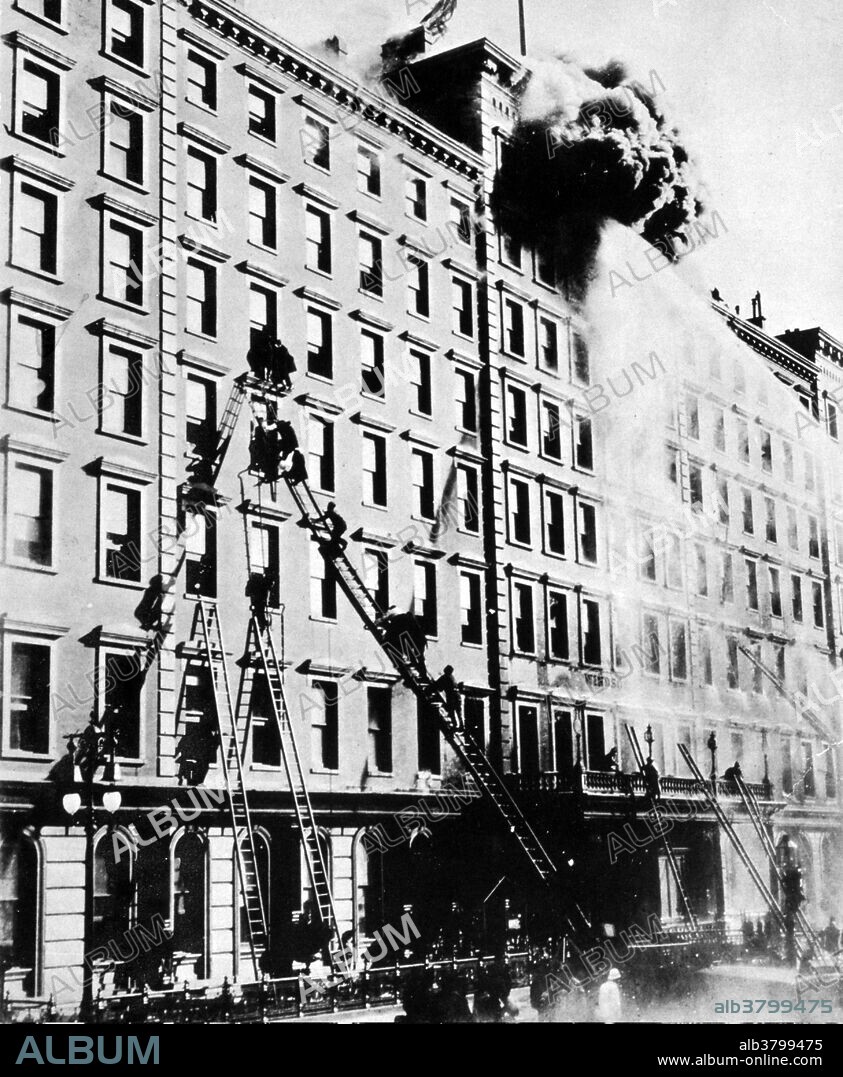 The Windsor Hotel was located at 575 Fifth Avenue in Manhattan, New York. The seven-story hotel opened in 1873, at a time when hotel residency was becoming popular with the wealthy, and was advertised as "the most comfortable and homelike hotel in New York. On St Patrick's Day 1899, while people were gathered below to watch the parade, a fire destroyed the hotel within 90 minutes. The fire supposedly started when someone threw an unextinguished match out of a second-floor window and the wind blew it against the lace curtains. Firemen, some of them still in their dress uniforms from the parade, made heroic rescues, but they were hampered by the crowds, the fire moved too fast for them to reach every window with ladders, and water pressure was inadequate. Almost 90 people died (estimates vary), with numerous bodies landing on the pavement. Some fell when escape ropes burned their hands, while others jumped in preference to being burned alive. The fire chief, Hugh Bonner, blamed the construction of the hotel for the rapid spread of the fire.