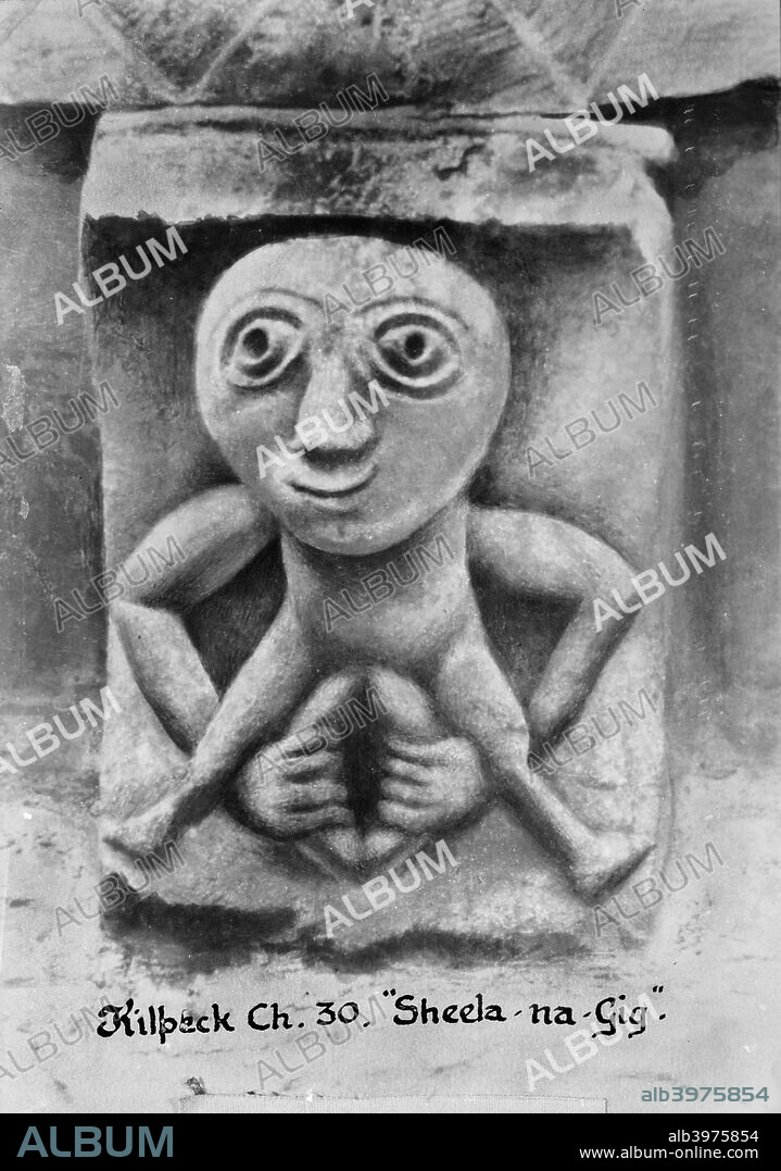 Sheela-na-Gig, Kilpeck, Herefordshire.The church of St Mary and St David, Kilpeck, is a remarkable example of a small Norman church of the 12th century.  It is heavily decorated with sculpture, including this Sheela-na-Gig which seems very pagan in its imagery. Sheela-na-gigs are female exhibitionist carvings found on walls, abbeys, convents, churches, pillars and other structures in Ireland, England, Scotland and Wales, as well as in other parts of Europe. They come in many different shapes and sizes, but all share the same characteristic of a prominent and often enlarged genitals, often held open by the figure's hands. Most date from the middle ages.