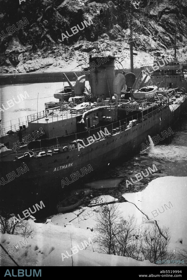 Brilliant Seamanship Helped To Beat "Altmark" - The German prison ship "Altmark" aground in Josing Fjord, Norway, the narrow waterway in which H.M.S. "Cossack" was manocuvred by brilliant seamanship alongside the Nazi vessel so that a boarding party could free the 300 British seamen held captives under intolerable conditions aboard the "Altmark". When this picture was made, the "Altmark" was still aground in the same position as on the night of the battle. February 26, 1940.