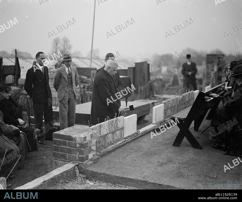 Sidcup Church Hall foundation stone laying . Mr Craig Smith taps the stone . 1938.