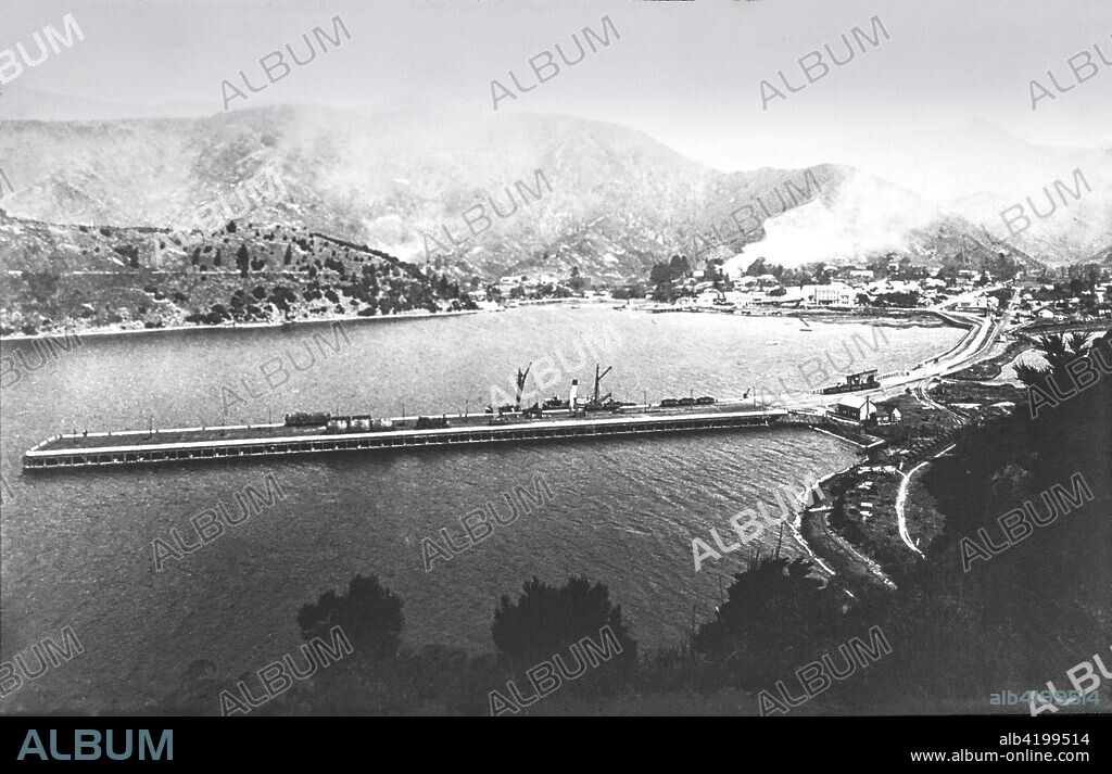 Magic lantern slide circa 1900.Victorian/Edwardian social history. Picton Harbour and Pier, New Zealand. Picton (M?ori: Waitohi) is a town in the Marlborough Region of New Zealand's South Island. The town is located near the head of the Queen Charlotte Sound, 25 km (16 mi) north of Blenheim and 65 km (40 mi) west of Wellington. Waikawa lies just north-east of Picton, and is often considered to be contiguous part of Picton. The town is named after Sir Thomas Picton, the Welsh military associate of the Duke of Wellington, who was killed at the Battle of Waterloo.