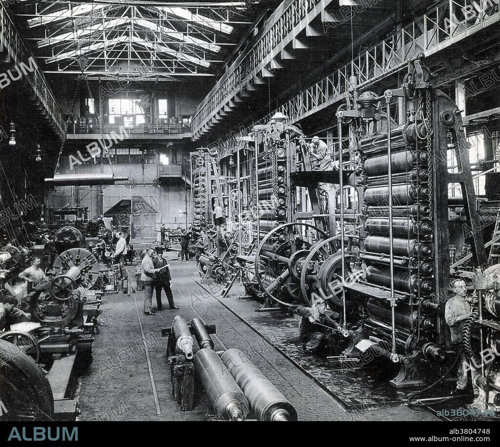 The Krupp family, a prominent 400 year old German dynasty from Essen, have become famous for their production of steel, artillery, ammunition, and other armaments. Friedrich Krupp built a pioneering steel foundry in Essen in 1810. His son Alfred invested heavily in new technology to become a significant manufacturer of steel rollers and railway tires. He also invested in the revolutionary Bessemer process and acquired many mines in Germany and France. The company began to make steel cannons in the 1840s. Low non-military demand and government subsidies meant that the company specialized more and more in weapons: by the late 1880s the manufacture of armaments represented around 50% of Krupp's total output. At the time Krupp's was the world's largest industrial company and the largest private company in the German empire. When Adolf Hitler came to power in Germany in 1933, the Krupp works became the center for German rearmament. The choices of the Krupp family and firm during the Nazi era, including support of Hitler and use of forced labour, are part of the legacy. No photographer credited, undated.