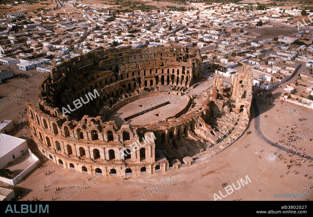 Roman amphitheatre at El Djem in Tunisia. The three tiers of arches rise 36 meters above the ground. Spectacles of gladiators fighting against each other and against wild animals were staged here. It is the third largest amphitheatre of the Roman world, having a capacity of between 30,000 and 45,000 people. It was built in the second century AD. El Djem (also known as El Jem) was the ancient city of Thysdrus.