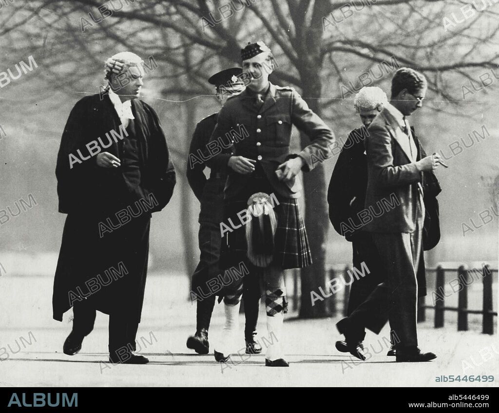 P. Shows - Lieut. Norman Baillie-Stewart, with his solicitor, Mr. Parkers photographed during a short interval. The first witness to be called today at the Court of Lieut. Norman Baillie-Stewart, the Officer of the Tower was the assused mans mother, Mrs. Elsie Wright. March 27, 1933. (Photo by Photo Press).