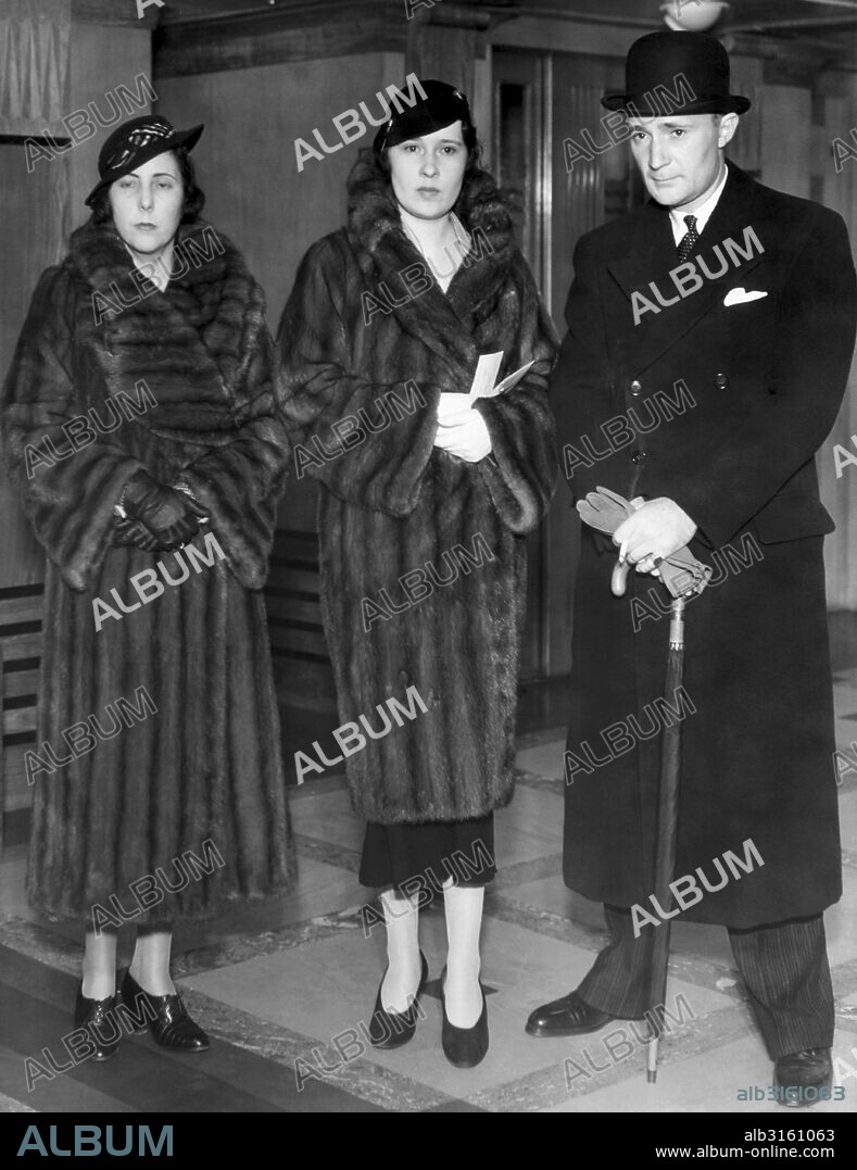 New York, New York: October 12,1934. Lady Furness, (center) the former Thelma Morgan, arrives in New York announcing that she would assist her twin sister, Mrs. Gloria Vanderbilt in the latter's custody battle for her daughter, also named Gloria. She arrived with her brother Harry Hays Morgan, Jr. and his wife.