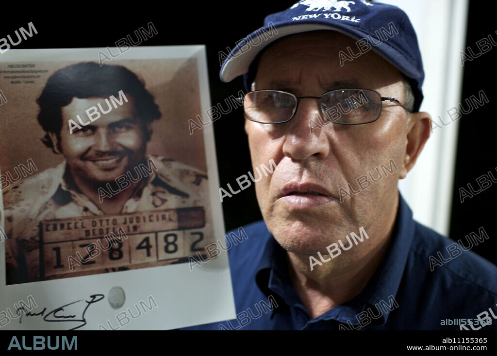 Roberto Escobar with a picture of his brother Pablo, Medellin, Colombia, South America.