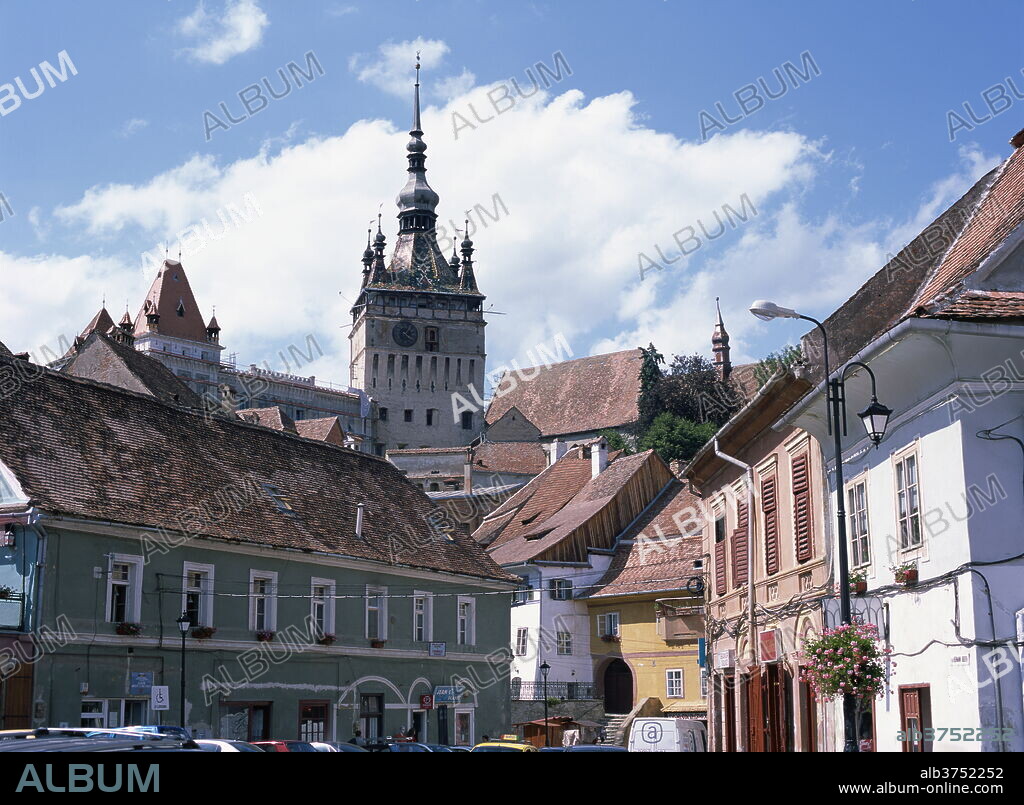 Clock tower, on old town citadel, from Piata Hermann Oberth, Sighisoara, UNESCO World Heritage Site, Transylvania, Romania, Europe.