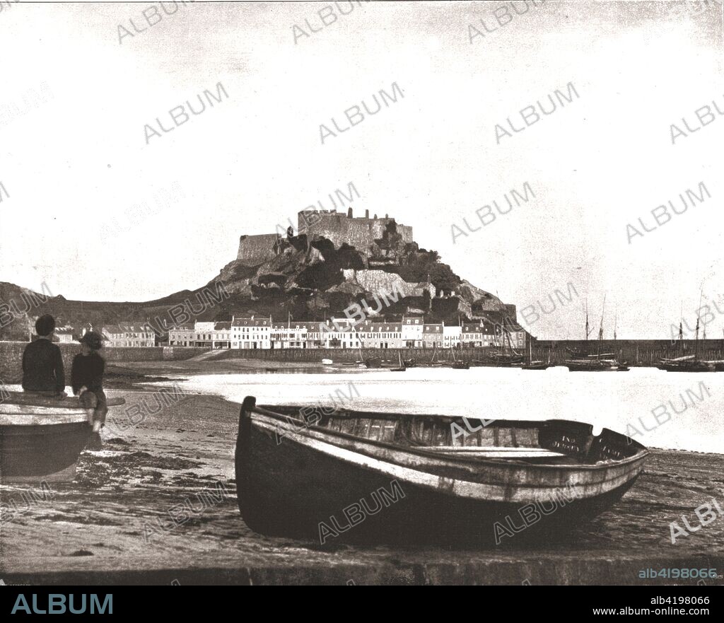 Mont Orgueil Castle, Jersey, 1894. Mont Orgueil Castle (also known as Gorey Castle) was built in the 13th century to defend Jersey from possible French invasion after the division of the territory of the Duchy of Normandy in 1204. The castle remained the island's primary defence until the advent of gunpowder made it indefensible from the neighbouring Mont St Nicholas hill. From Beautiful Britain; views of our stately homes. [The Werner Company of Chicago, 1894].