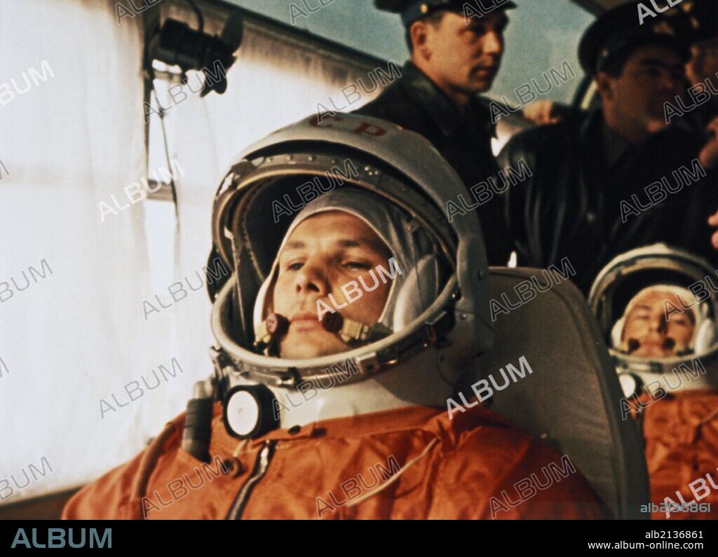 Cosmonaut yuri gagarin on a bus on the way to the launch site of vostok i april 12, 1961, seated behind him is his substitute, gherman titov. 01/02/2013