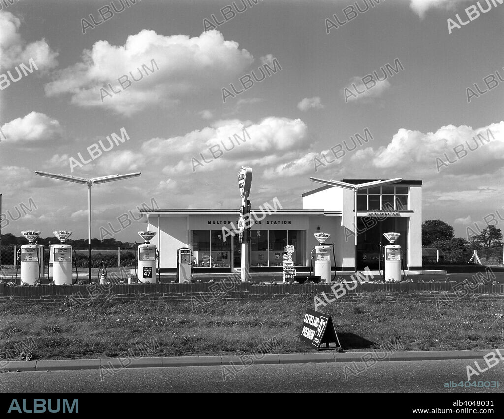 Cleveland Petrol Station, Marr, South Yorkshire, 1963. An early 1960s petrol station in the village of Marr, close to the A1 between Doncaster and Barnsley. The station was run by Clevelend Petrols, which were marketed by an independent company based in north-east England. The name comes from the Cleveland Hills, not from Cleveland, Ohio in the USA. In the 1930s, this company was bought by the Anglo-American Oil Co (Esso), but the Cleveland name was retained, largely as the subsidiary marketed a benzole blend and an alcohol mixture called Discol. In 1973, Esso chose to end Cleveland brand and gave up selling benzole or alcohol blends. Cleveland's 2000 filling stations were soon switched to the Esso brand. In the service bay, a Mk 1 Ford Cortina can be seen. The service station still existed as of 2009 but the site was derelict.