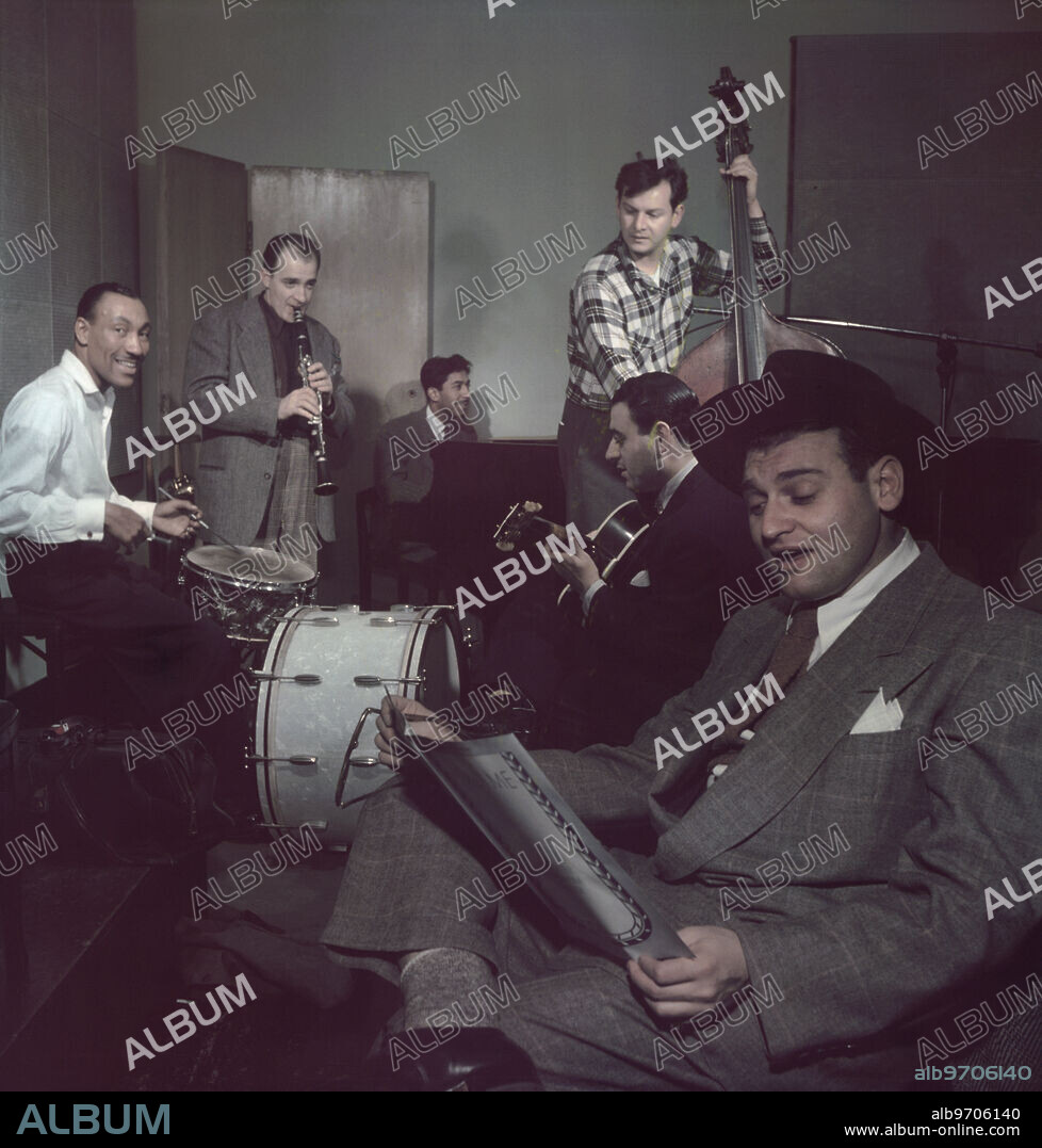 Portrait of Frankie Laine (foreground) and Jimmy Crawford (left on drums), New York City, New York, USA, William P. Gottlieb Collection, 1948.