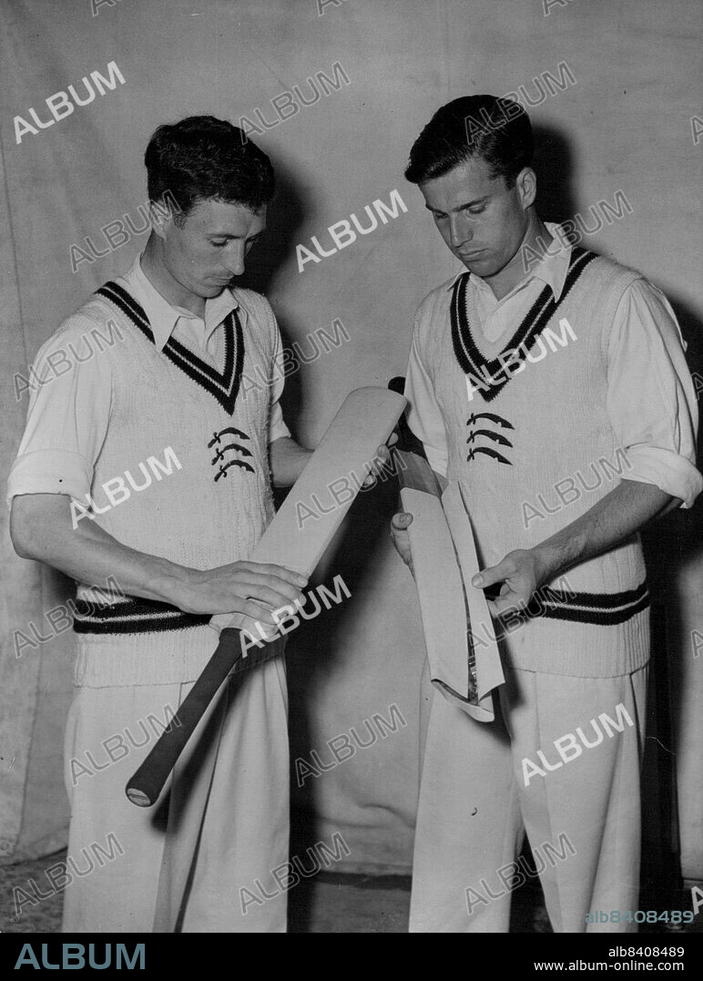 New Lease of Life for ***** Bats -- New plastic cover to save wear and tear on cricket bats is examined by Middlesex players Freddy Titmus and Don Bennett (right) at the Chiswick (London) Indoor School of Cricket.Bannett holds a bat partly encased in the new Mouldex cover.The cover, made from a new plastic material, is fixed to the at with adhesive and adds only little more than five ounces to the weight. In position, it provides an impervious surface, waterproof, and needing no killing. It can be easily cleaned with soap and water.The now cover, it is claimed, will reduce cost of repairs and renewals of cricket bats. July 21, 1954.
