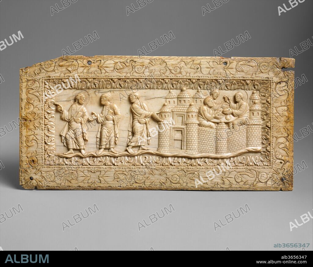 Plaque with Scenes at Emmaus. Culture: Carolingian. Dimensions: Overall: 4 9/16 x 9 1/4 x 1/4 in. (11.5 x 23.5 x 0.6 cm). Date: ca. 850-900.
Among the finest ivory carvings in the Cloisters collection, this plaque depicts Christ's appearance to two of his disciples after his Resurrection. Christ, who is distinguished by his halo, meets the disciples along the road to the town of Emmaus, near Jerusalem. As described in the Gospel of Luke (24:13-35), although not recognizing Christ, they urge him to stay in town with them. Once within Emmaus, they finally recognize him as he breaks bread for their shared evening meal. Judging from the horizontal format and the recesses along the top edge to accommodate hinges, this plaque once served as the back panel of a small coffret. Originally, the recessed images of birds and flowers in the border were filled with gold foil.