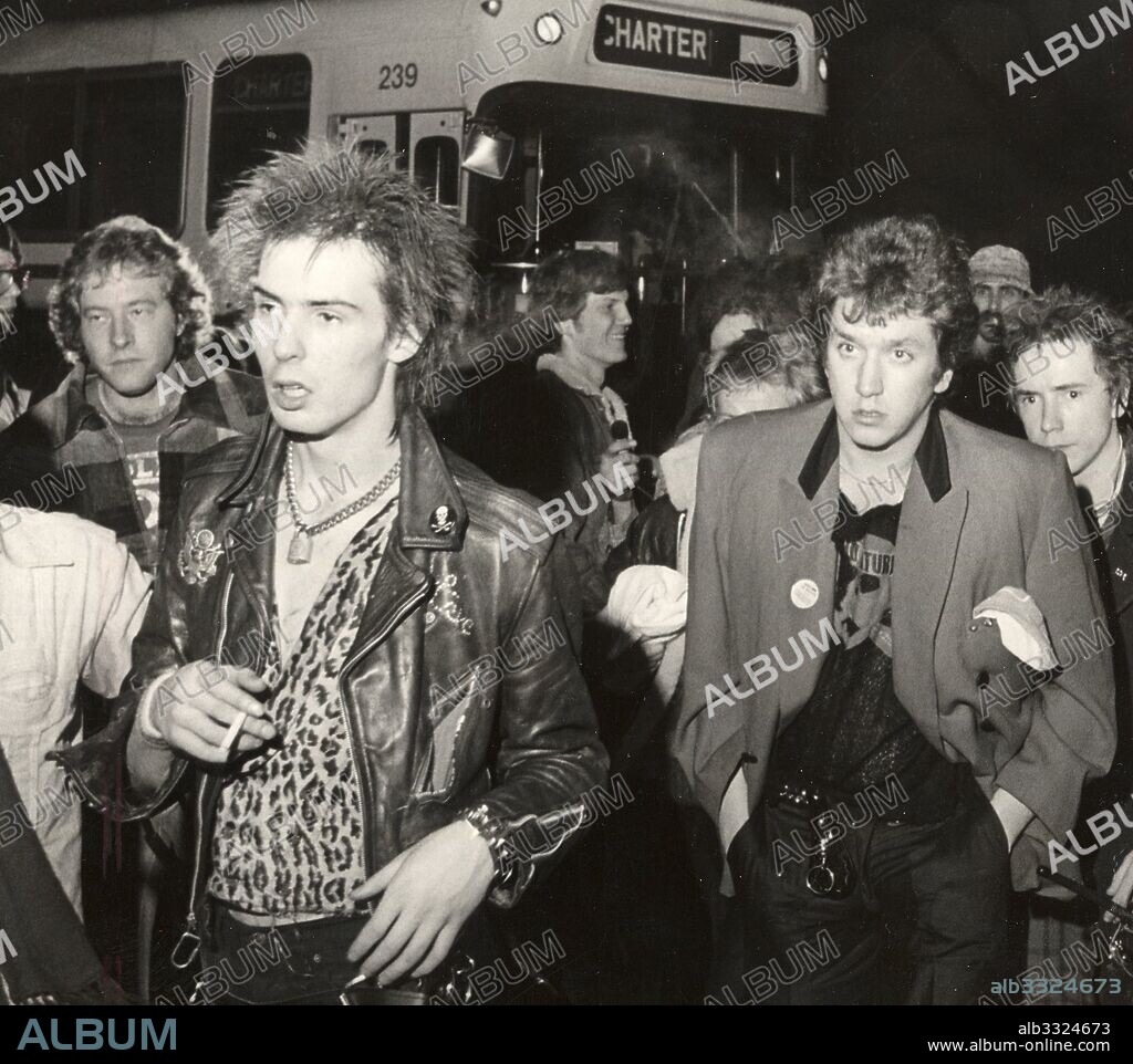 Jan 8, 1978 - Memphis, Tennessee, U.S. - Members of the Sex Pistols SID VICIOUS (with cigarette), STEVE JONES and JOHNNY ROTTEN (behind Jones) arrived at Midtown's Taliesyn Ballroom January 6, 1978 amid a tense scene as the concert had been oversold and angry fans mobbed outside the venue. Inside, the audience waited 90 minutes for the band to take the stage. The group managed to perform five more U.S. dates, before Rotten quit on Jan. 18. Vicious decamped to New York's Chelsea Hotel, where his girlfriend, Nancy, would die under mysterious circumstances in October. Cook and Jones formed a new group, The Professionals. And 13 months after performing in Memphis, Vicious died of a heroin overdose. The location the Sex Pistols played in Memphis is now a Taco Bell on Union Ave. 08/01/1978