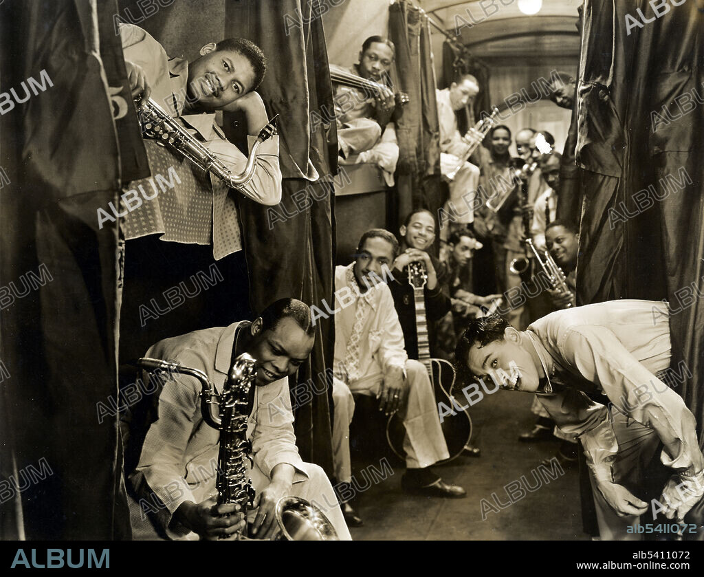 Calloway and his band in a sleeper car. Cab Calloway (1907 - 1994) was an African-American jazz singer, dancer, bandleader and actor. Calloway was a master of scat singing and led one of the most popular big bands from the 1930s-40s. By mixing jazz and vaudeville he won popular acclaim during a career that spanned over 65 years. No photographer credited, 1933 (cropped and cleaned).