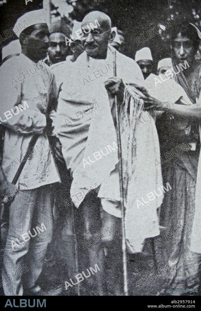 Mahatma Gandhi, Indian mystic and political leader, with some of his followers. 1930.