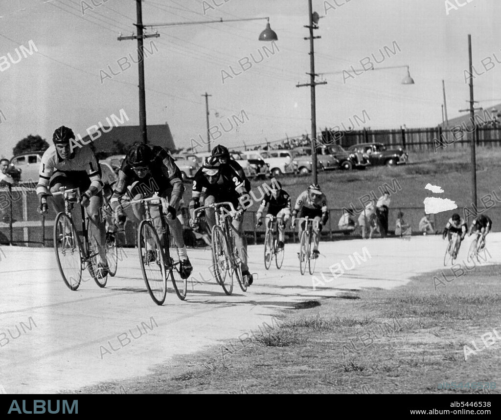 6 day cycle race. Finish of half hourly sprint. Harold Jensen (centre) was first, and Lionel Cox (left) was second. November 20, 1954. (Photo by Wright/Fairfax Media).