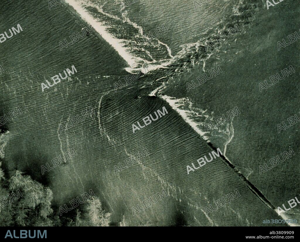 The Great Mississippi Flood of 1927 was the most destructive river flood in the history of the United States. The flood began when heavy rains pounded the central basin of the Mississippi in the summer of 1926. By September, the Mississippi's tributaries in Kansas and Iowa were swollen to capacity. Flooding overtook the levees causing the Mounds Landing to break with more than double the water volume of Niagara Falls. The Mississippi River broke out of its levee system in 145 places and flooded 27,000 square miles. This water flooded an area 50 miles wide and more than 99 miles long. The flood caused over $400 million in damages and killed 246 people in seven states. The flood affected Arkansas, Illinois, Kentucky, Louisiana, Mississippi, Missouri, Tennessee, Texas, Oklahoma and Kansas. By May 1927, the Mississippi River below Memphis, Tennessee, reached a width of 60 miles. Photo originally captioned: "The Great Mississippi River Flood of 1927. Frontispiece - beginning of crevasse breaching levee at Mounds Landing, Miss." From: "The Floods of 1927 in the Mississippi Basin", Frankenfeld, H.C., 1927. Monthly Weather Review Supplement No. 29.