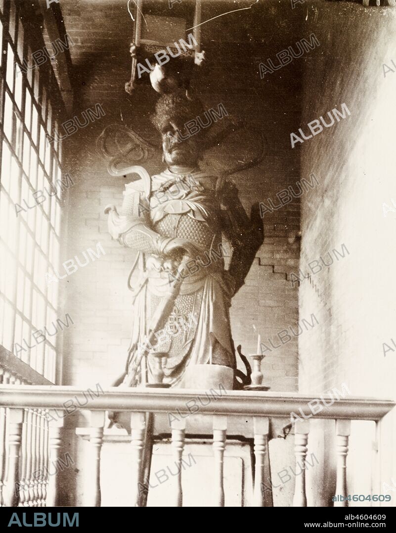 Hong KongChina, Statue of a Chinese deity (a 'Joss'), located in a Joss house in Hong Kong. The figure is depicted as a warrier, wearing a crown and armour, and holding a sword. Original manuscript caption: Joss, circa 1903. 1998/028/1/1/41.