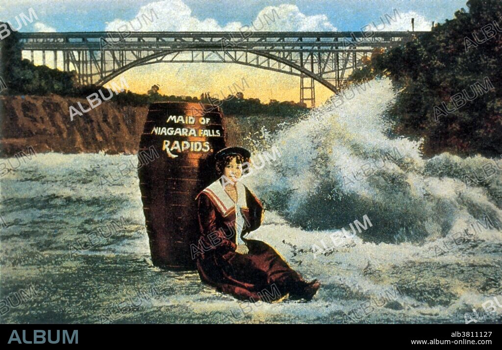 Annie Edson Taylor (October 24, 1838 - April 29, 1921) was an American teacher. Desiring to secure her later years financially, she decided she would be the first person to ride over Niagara Falls in a barrel. Taylor used a custom-made barrel for her trip, constructed of oak and iron and padded with a mattress. On October 24, 1901, her 63rd birthday, the barrel was put over the side of a rowboat, and Taylor climbed in, along with her lucky heart-shaped pillow. After screwing down the lid, friends used a bicycle tire pump to compress the air in the barrel. The hole used for this was plugged with a cork, and she was set adrift near the American shore. The Niagara currents carried the barrel over the Canadian Horseshoe Falls. Rescuers reached her barrel shortly after the plunge. Taylor was discovered to be alive and relatively uninjured, except for a small gash on her head. She briefly earned money speaking about her experience, but was never able to build much wealth. She spent her final years posing for photographs with tourists at her souvenir stand, working as a clairvoyant, and providing magnetic therapeutic treatments to local residents. She died in 1921 at the age of 82. No photographer credited, undated.