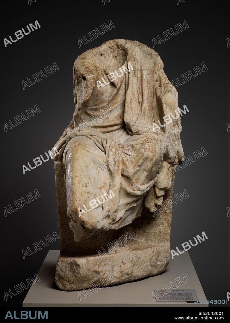 Marble statue of a draped seated man. Culture: Roman. Dimensions: H. 51 1/2 in. (130.8 cm). Date: 1st century B.C..
Copy of a Greek statue of the mid-2nd century B.C.
Seated; fragmentary. Perhaps portrait statue of poet or philosopher; copy Greek original 2nd century B.C.
For the ancient Greeks, it was important to represent the entire figure in a portrait, not just the head as became popular in the Roman period. Although the head of this Roman copy is missing, the turn of the upper body to the left, the three holes beneath the left shoulder, and the angular hollow at the inner side of the left arm suggest that the figure was playing the kithara and consequently, is best identified as a poet. It may be a retrospective portrait of one of the great Greek poets of the Hellenistic age, such as Kallimachos or Theokritos, or perhaps one of the legendary bards of earlier days portrayed in Hellenistic style. On the front of the seat, above the left foot, is the signature of the sculptor Zeuxis. He must have been one of the many copyists of the Roman period who attached their signatures to their works.