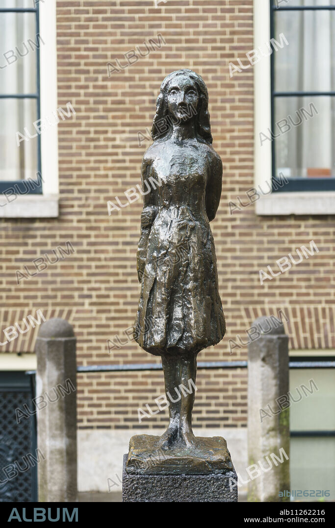 Statue of Anne Frank outside Westerkerk Church, Amsterdam, North Holland, The Netherlands, Europe.