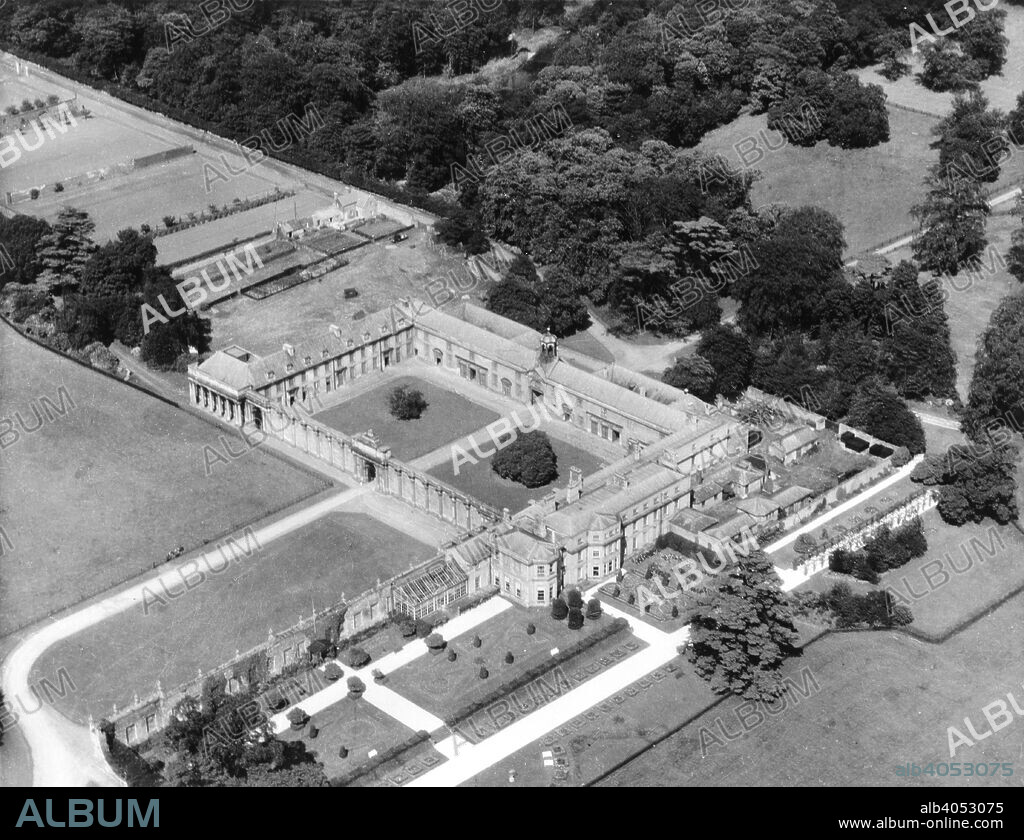 Aerial view of Worksop Manor, Nottinghamshire, August 1956. A Victorian house stood at this time which replaced a far larger residence which contained 500 rooms. The older building was undergoing alterations, which had cost the Duke of Norfolk £22,000 and which were nearly completed, when on October 20th, 1761, the whole building was burnt to the ground. The grounds were once part of a medieval parkland. Leland, writing in the reign of Henry VIII, says By Worksoppe is a parke of six or seven miles in compace, longging to the Earl of Shrewsbury.