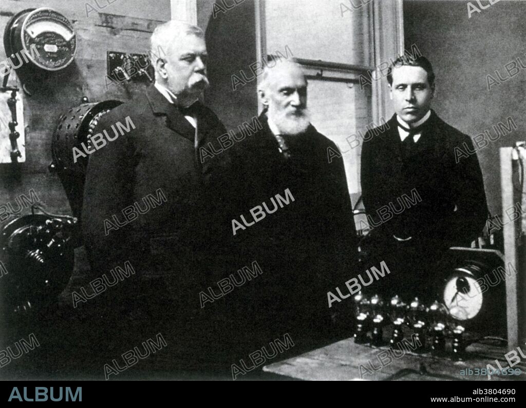 George Westinghouse (left) with Lord Kelvin (center) visiting Westinghouse Electric Company, August 1897. The International Niagara Falls Commission, headed by Lord Kelvin, created a contract for the job to harness the power from the Niagara Falls. Many companies came up with different ideas, including Edison, but they were all rejected. Kelvin had always been against the idea of AC, but after attending the World's Fair, he asked the Westinghouse Corporation to use AC power for the harnessing of Niagara Falls. Westinghouse was awarded the contract in 1893 and funding was provided by some of the wealthiest men in America including J.P. Morgan, Lord Rothschild, and W.K. Vanderbilt. Construction finished and the switch was thrown on November 16th, 1896 and to the investor's relief, the plant worked perfectly. Ten more generators were built in the years to follow, and Niagara Falls was eventually powering much of New York. George Westinghouse, Jr. (October 6, 1846 - March 12, 1914) was an American entrepreneur and engineer who invented the railway air brake and was a pioneer of the electrical industry. No photographer credited, the man on the right was not identified, August 1897.