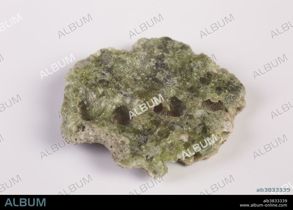 Trinitite, also known as atomsite or Alamogordo glass, is the glassy residue left on the desert floor after the plutonium-based Trinity nuclear bomb test on July 16, 1945, near Alamogordo, New Mexico. The glass is primarily composed of arkosic sand composed of quartz grains and feldspar that was melted by the atomic blast. Trinitite is mildly radioactive but is safe to handle for short periods of time.