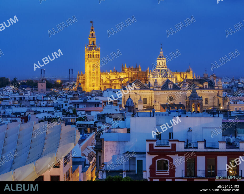 View from Metropol Parasol towards The Church of the Divine Savior and The Cathedral at dusk, Seville, Andalusia, Spain, Europe.