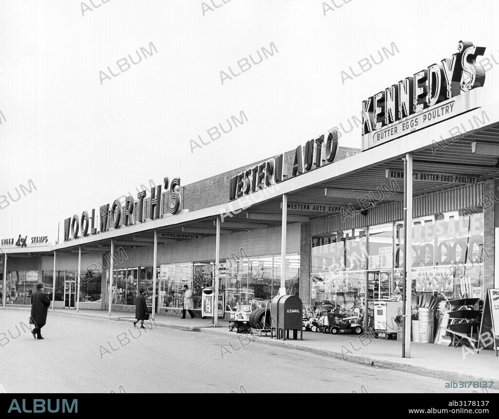 Worcester, Massachusetts:   c. 1960 A strip mall shopping center with S&H Green Stamps, Woolworth's, Western Auto, and Kennedy's stores.   © Underwood Archives / The Image Works.