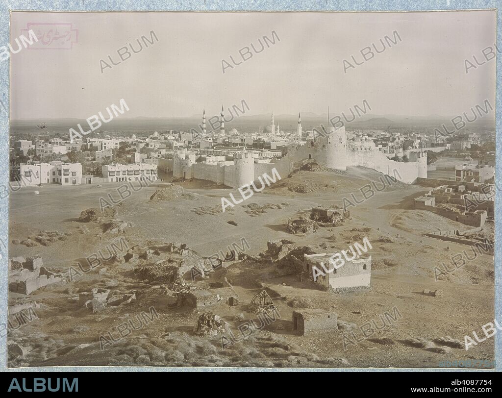 H. A MIRZA AND SONS. The city of Medina. Album of 'Views of Mecca and Medina'. Published by the Photographers: Delhi [Octr. 15, 1907.]. Maroon quarter-leather album, 457x384mm, containing prints in window mounts with handwritten Arabic captions. On the reverse of each print is a letterpress description in English which reads: 'H.A. Mirza & Sons, Photographers. [....[caption]....with a brief description.] One sheet. Published by the Photographers: Delhi [Octr. 15, 1907.] 14x18Â° Litho. 1st Edition. Price, R.1, A4'. The album contains historical and architectural views from Saudi Arabia. Source: Photo 174/(7).