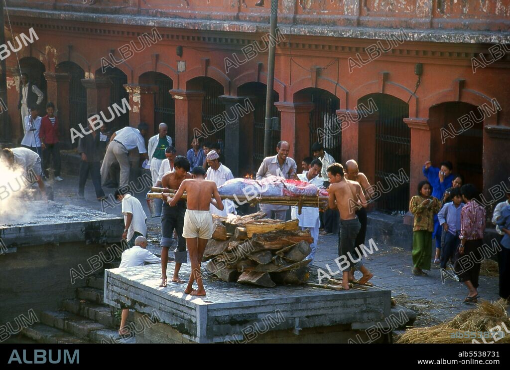 At Pashupatinath the cremation <i>ghat</i> (steps) are divided into two sections, Arya Ghat (Steps of the Nobles) and Surya Ghat (Steps of the Sun). The former is reserved for members of the higher castes, including members of the royal family, the latter for the common people.   The most revered Hindu site in Nepal is the extensive Pashupatinath Temple complex, five kilometres east of central Kathmandu. The focus of devotion here is a large silver Shivalingam with four faces of Shiva carved on its sides, making it a 'Chaturmukhi-Linga', or four-faced Shivalingam. Pashupati is one of Shiva’s 1,008 names, his manifestation as 'Lord of all Beasts' (pashu means 'beasts', pati means 'lord'); he is considered the guardian deity of Nepal.  The main temple building around the Shivalingam was built under King Birpalendra Malla in 1696, however the temple is said to have already existed before 533 CE. In 733 CE, King Jayadeva II erected in its precincts a stone tablet which chronicled all the kings of Nepal, beginning with the sun god. During the Muslim raids of 1349 the temple was largely destroyed, but in 1381 Jayasinharama Varddhana of Banepa restored it. Further renovations were conducted towards the end of the Malla period, and the latest extensive improvements were made in 1967.  Since the temple's inception, all the rulers of Nepal have taken great pains to pay their respects to it, to make donations, and to finance extensions.