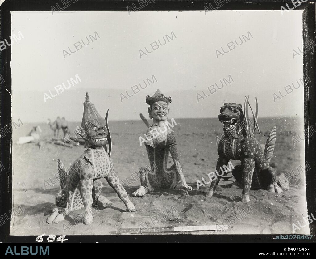SIR MARC AUREL STEIN. Three winged monsters. 23-Jan-15. Painted stucco figures of monsters from Tomb Ast. iii. 2, Astana Cemetery, near Kara-khoja.].  Originally published/produced in 23 January 1915. . Source: OIOC Photo 392/28(684),.