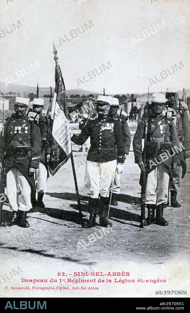 Flag of the 1st Regiment of the French Foreign Legion, Sidi Bel Abbes, Algeria, 1933. The flag is inscribed with the names of battles in which the Legion fought, including Sevastopol (1855), Kabylia (1857), Magenta (1859) and Camaron (1863). Sidi Bel Abbes was the Legion's headquarters from 1931-1961. French postcard.