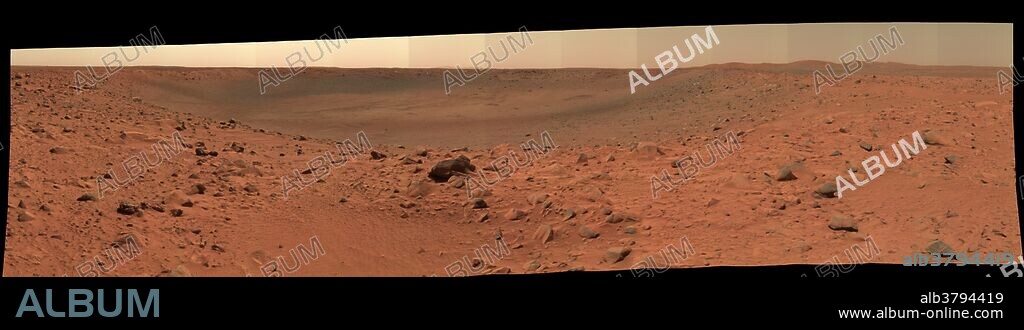 The rim and interior of a crater nicknamed "Bonneville" dominate this 180-degree, false-color mosaic of images taken by the panoramic camera of NASA's Mars Exploration Rover Spirit. Spirit recorded this view on the rover's 68th sol, March 12, 2004, one sol after reaching this location. The rover remaining here in part to get this very high-resolution, color mosaic, from which scientists can gain insight about the depth of the surface material at Bonneville and make future observation plans. The light blue object on the far rim of the crater is Spirit's heat shield.