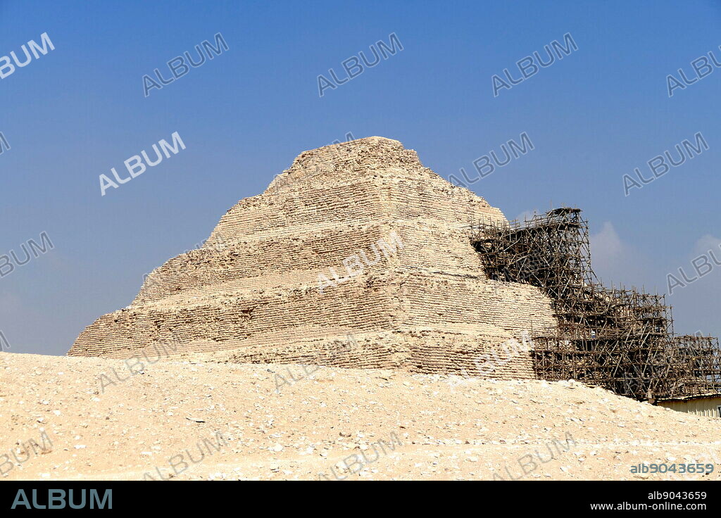 Step Pyramid of Djoser, at Saqqara, Egypt. Saqqara was an ancient burial ground in Egypt, serving as the necropolis for the Ancient Egyptian capital, Memphis. Djoser was the first or second king of the 3rd Dynasty (ca. 2667 to 2648 BC) of the Egyptian Old Kingdom (ca. 2686 to 2125 BC).