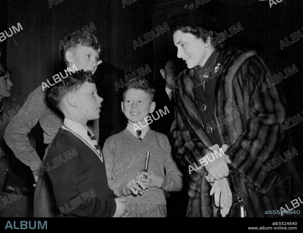 The Duchess Meets Three Young Emigrants -- After the opening ceremony today, the Duchess of Gloucester chats with three of the Youngsters at the John Howard Mitchell House, who will soon be emigrating to Australia. They are, John from Wales, Ernest from Co. Durham, and, at back, Malcolm from Bristol, John is clutching a 'six-shooter'.The Duke and Duchess of Gloucester today performed the opening ceremony of John Howard Mitchell House at Knokholt in Kent. This is now the home of the Fairbridge Society, Which assists orphans and unwanted Children of large families to emigrate and start a new life in farm schools in Australia. November 05, 1951. (Photo by Fox Photos).